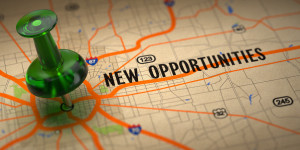 New Opportunities - Green Pushpin on a Map Background.